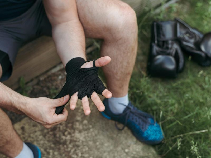 Close up of sports equipment and athlete preparing for session